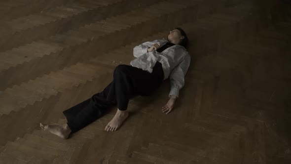 Woman Lying in Floor