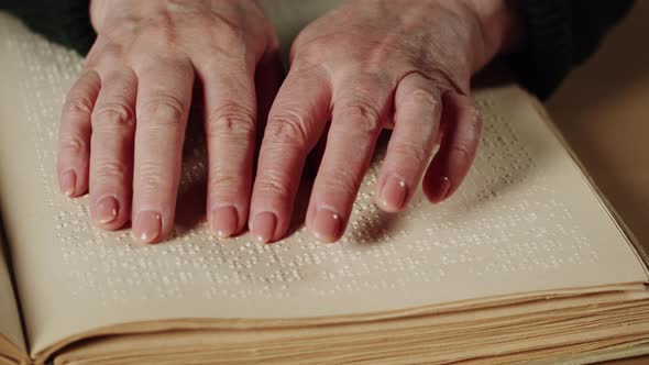 Blind Woman Reading Braille Book Using Fingers Closeup Poorly Seeing Female Person Learning to Read alt