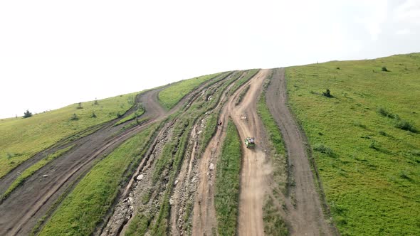 Aerial View Suv Vehicle Going Up By Hill to the Top of Mountain alt