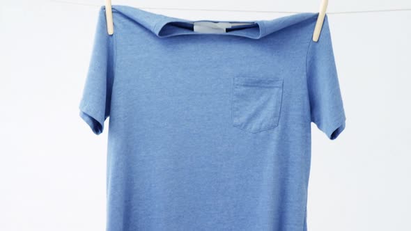 T-shirt drying on clothes line alt