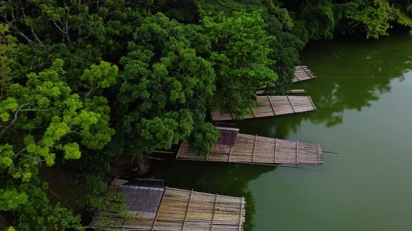 Bamboo raft docking on the river side alt