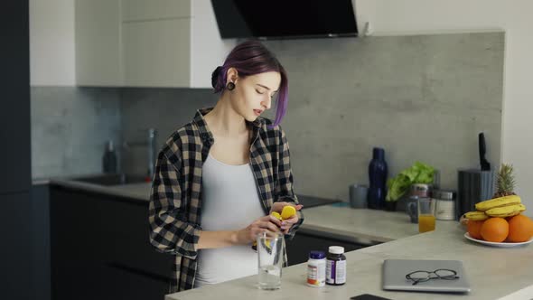 Brunette Lady Takes Necessary Vitamins at Kitchen alt