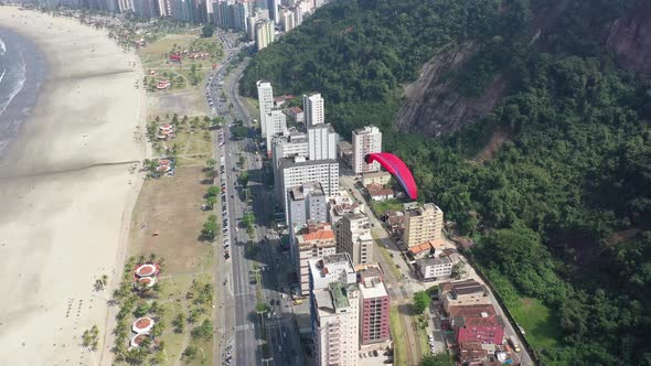 Panning wide landscape of coast city of Sao Vicente state of Sao Paulo Brazil. alt