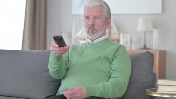 Old Man Watching TV at Home alt