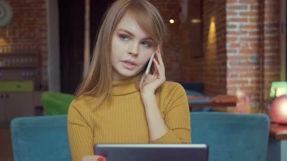 Charming smiling woman talking on mobile phone