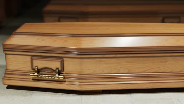 Animation of a wood coffin standing on the stone floor before the funeral. 4KHD alt
