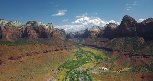 Drone moves away from the canyon settlement (Zion National Park, Utah, USA) alt