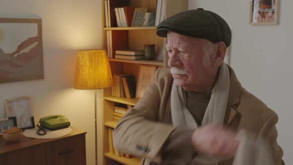 Senior Man Throwing on Scarf alt