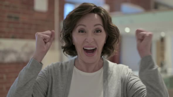 Portrait of Cheerful Old Woman Celebrating Success alt