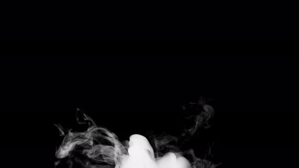 Soft fog in slow motion on dark background alt