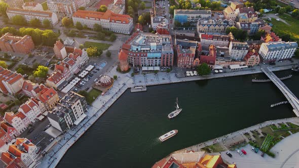 The Camera Flies Over the Center of a European City with Canals and Trees alt