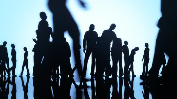 Silhouettes of a crowd of walking and standing people. Every day big city life. alt