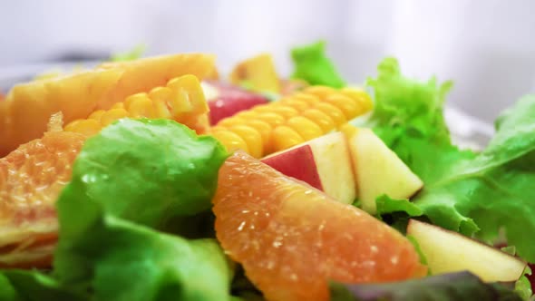 Organic Green Salad with Various Kinds of Fruits in Rotating Macro Shot  Healthy Life alt