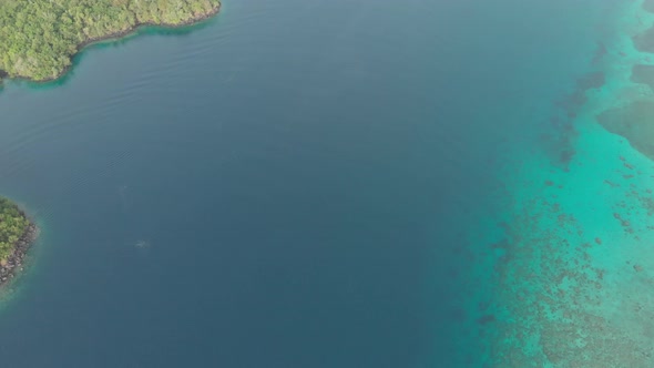 Aerial: flying over tropical island Banda Islands Maluku Indonesia