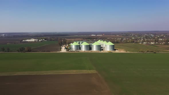 Aerial View of the Steel Grain Silos Outdoors Near the Fields