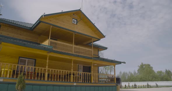 Facade of Big Wooden House with Sky on the Back