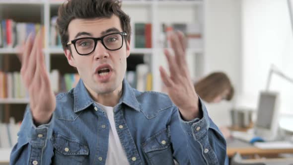 Young Man Reacting to Project Failure alt