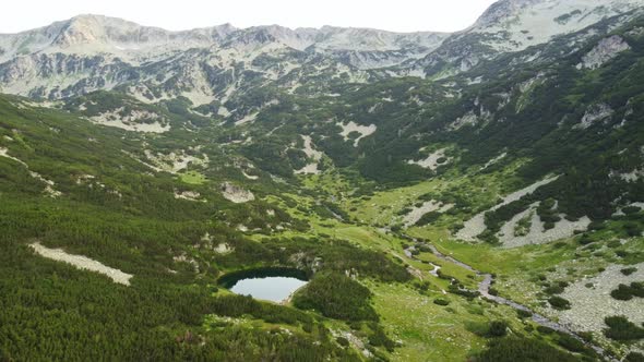Aerial View of a Lake in the Pirin Mountains with Blue Clear Water alt