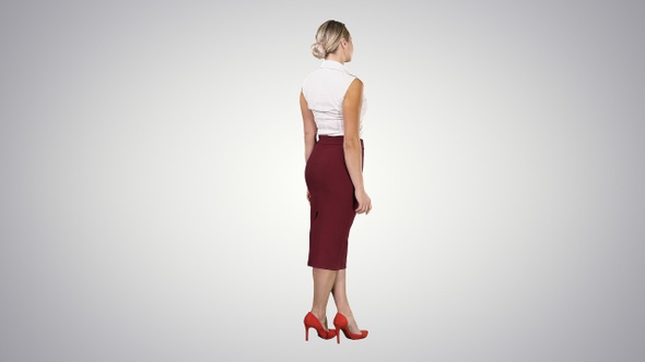 Woman Putting Her Hands on Her Hips on Gradient Background alt