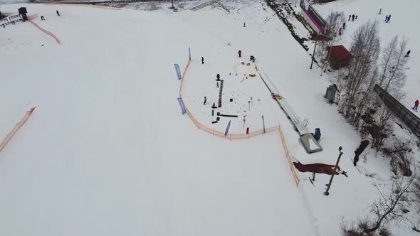 Aerial View of Downhill Skiing at Local Ski Resort, Ski Lift, Russia, Leningrdaskaya Oblast, Village