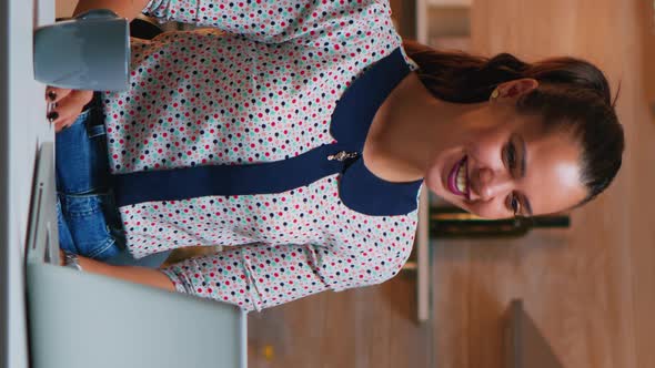 Vertical Video: Entrepreneur Having Video Conference with Colleagues alt