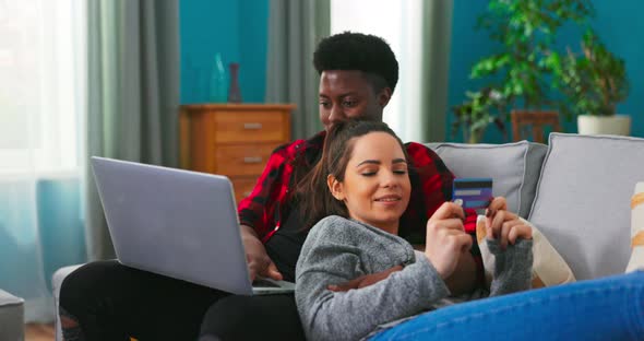 Happy Married Couple Wife and Husband Shopping Online and Buying on Internet alt