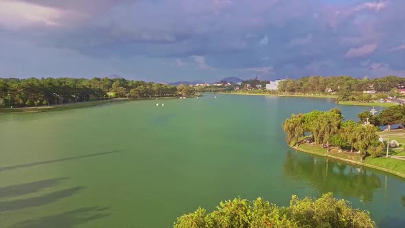 Flycam Removes From Tranquil Green Lake with Island alt