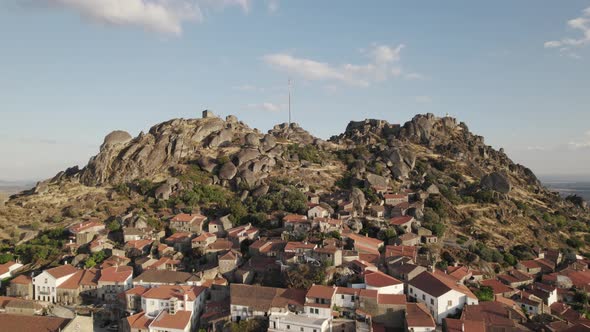 Hilltop village of Monsanto, Portugal. Houses between massive granite rocks against hilltop Castle