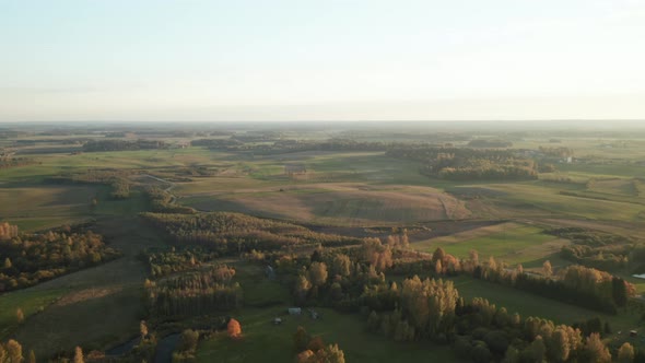 AERIAL: Rotating Shot of Vast Green Fields and Plains in Europe