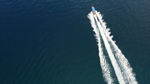 Follow up scene of the boat cruising on clear water 