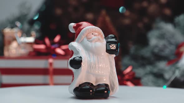 Figurine of Santa Claus on the background of New Year's gifts.New year and christmas concept.