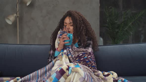 Sick Woman Suffering From Flu Sneezing on Couch alt