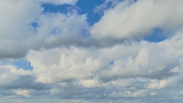Cumulus clouds in the blue sky, autumn day timelapse
