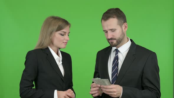 Female Professional Receiving Salary Against Chroma Key alt