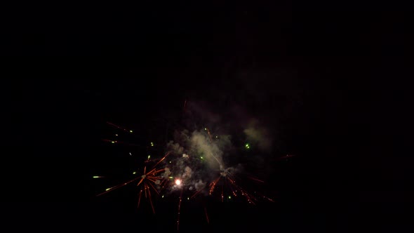 Fireworks explode on black background alt
