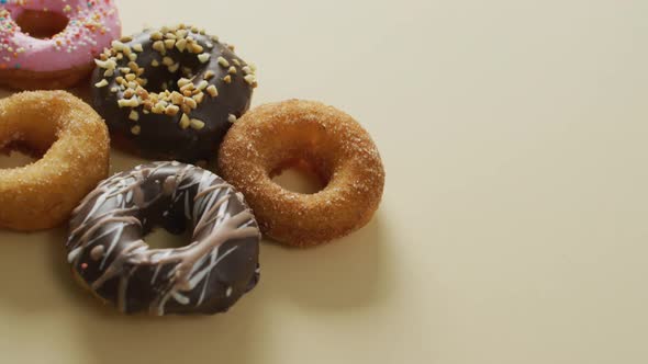 Video of donuts with icing on white background alt