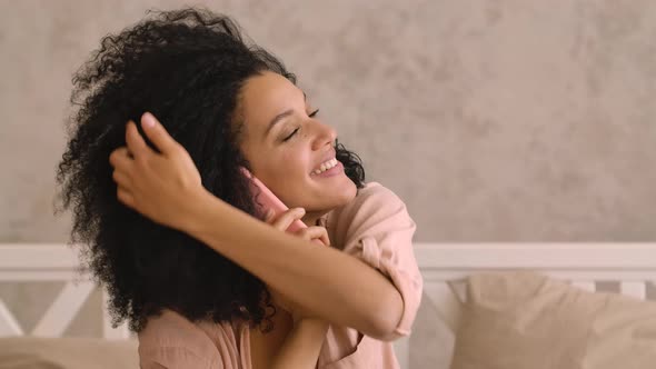 Portrait Cute African American Woman Talking on Smartphone and Smiling Happily alt