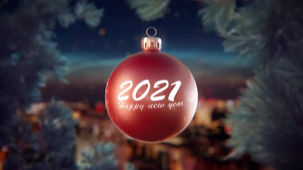 Red christmas ball with 2021 happy new year text bokeh stars and sky background