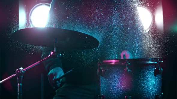 Super Slow Motion Shot of Drum Hit and Splashing Water at 1000 Fps alt