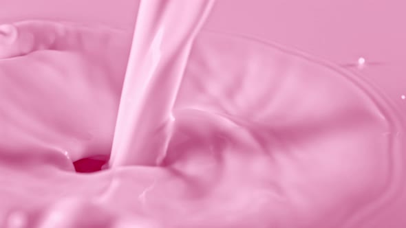 Super Slow Motion Shot of Pouring and Splashing Strawberry Milk at 1000Fps alt