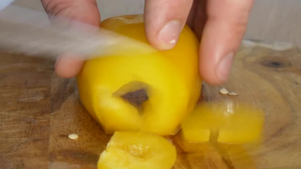 Close - Up Shot of Male Hands Cutting Pepper. Making Salad. alt