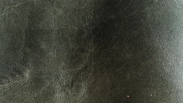 Black Leather Closeup Production of Handmade Accessories Made of Genuine or Artificial Animal Skin alt