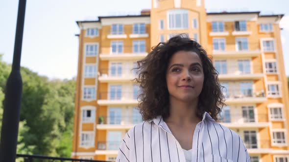 Hispanic Young Woman Checking Social Media on Her Smartphone alt