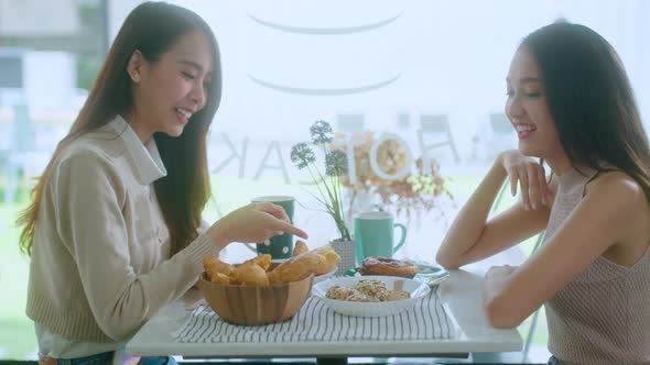 asian female talking good positive conversation to friends with smiling laugh and happiness