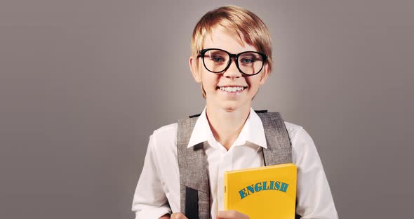 Boy with English Book Isolated on Background