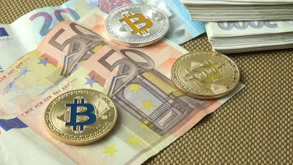 Bitcoins close-up on euro currency background. 