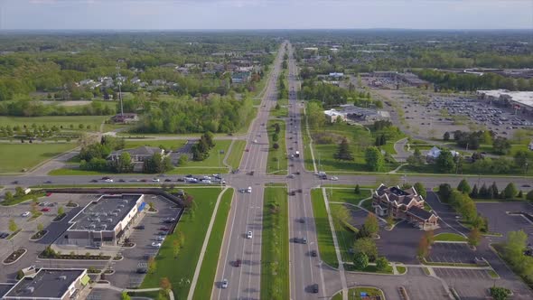 Aerial drone shot of a busy divided highway in Grand Rapids, Michigan alt