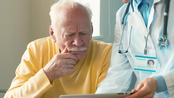 Old man listening to doctor