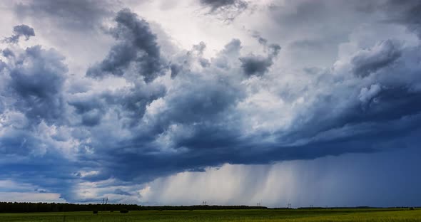 -Timelapse Storm Clouds and Heavy Rain. Timelapse of the Beginning of a Thunderstorm