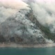 Plumes of white smoke rising from burning forest. Catastrophic fire caused by climate change - VideoHive Item for Sale